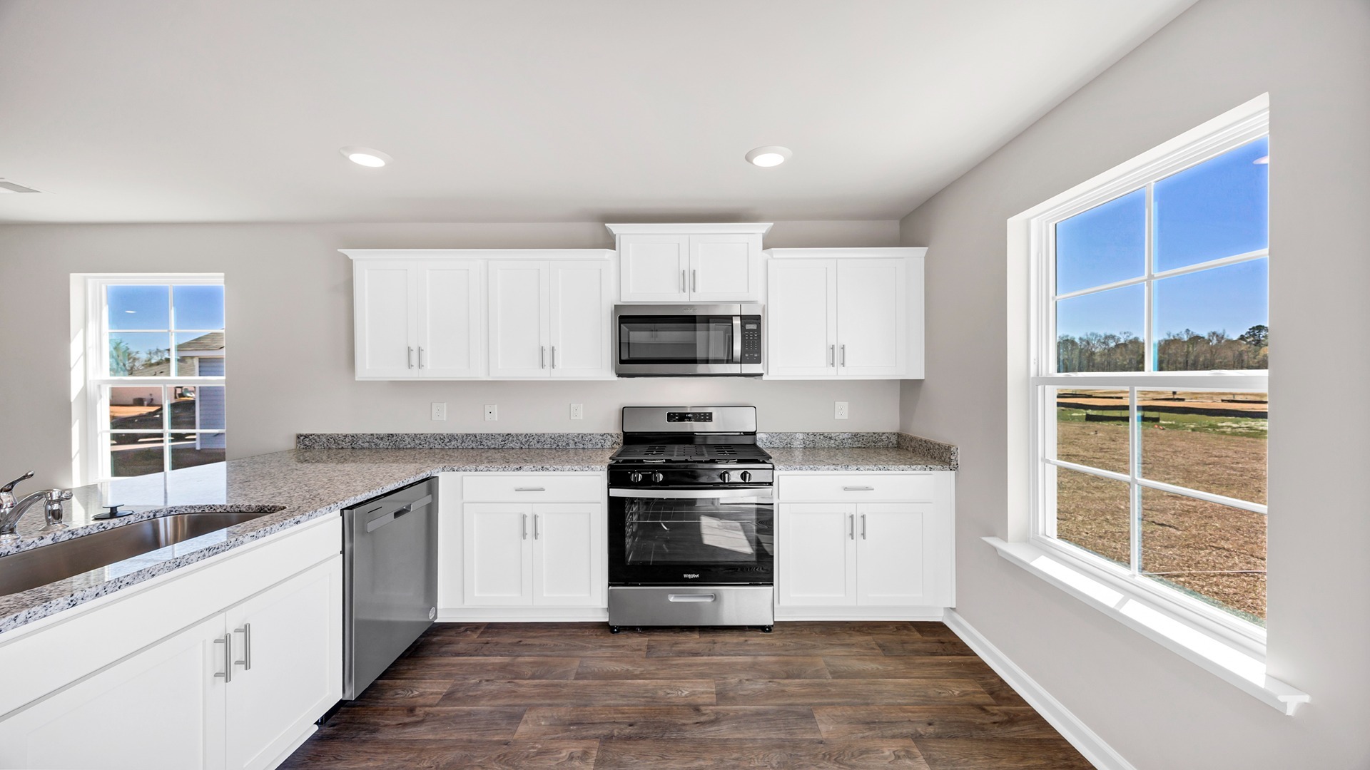 Natural light from a window in the kitchen space.