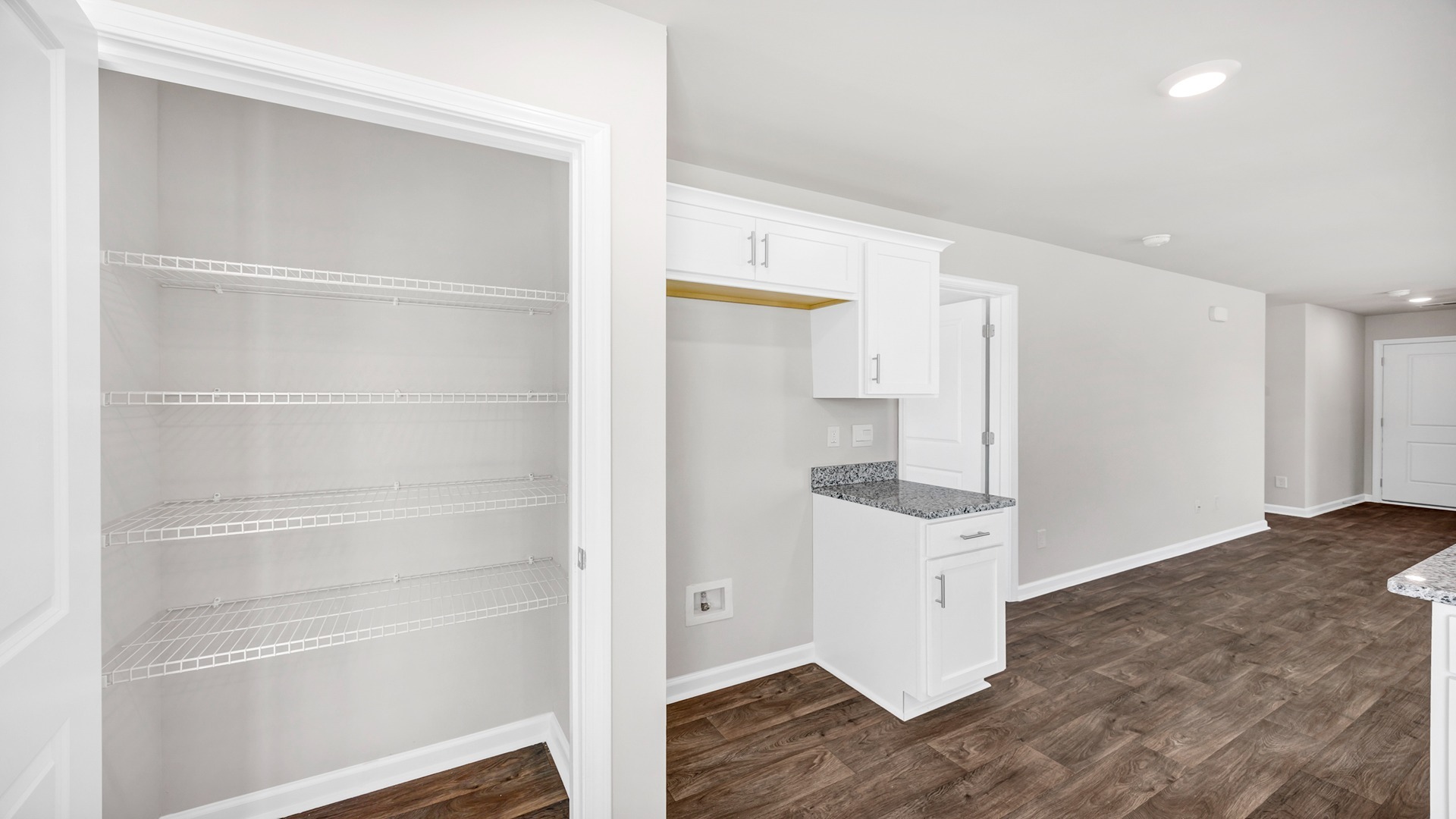 There is a spacious kitchen pantry.