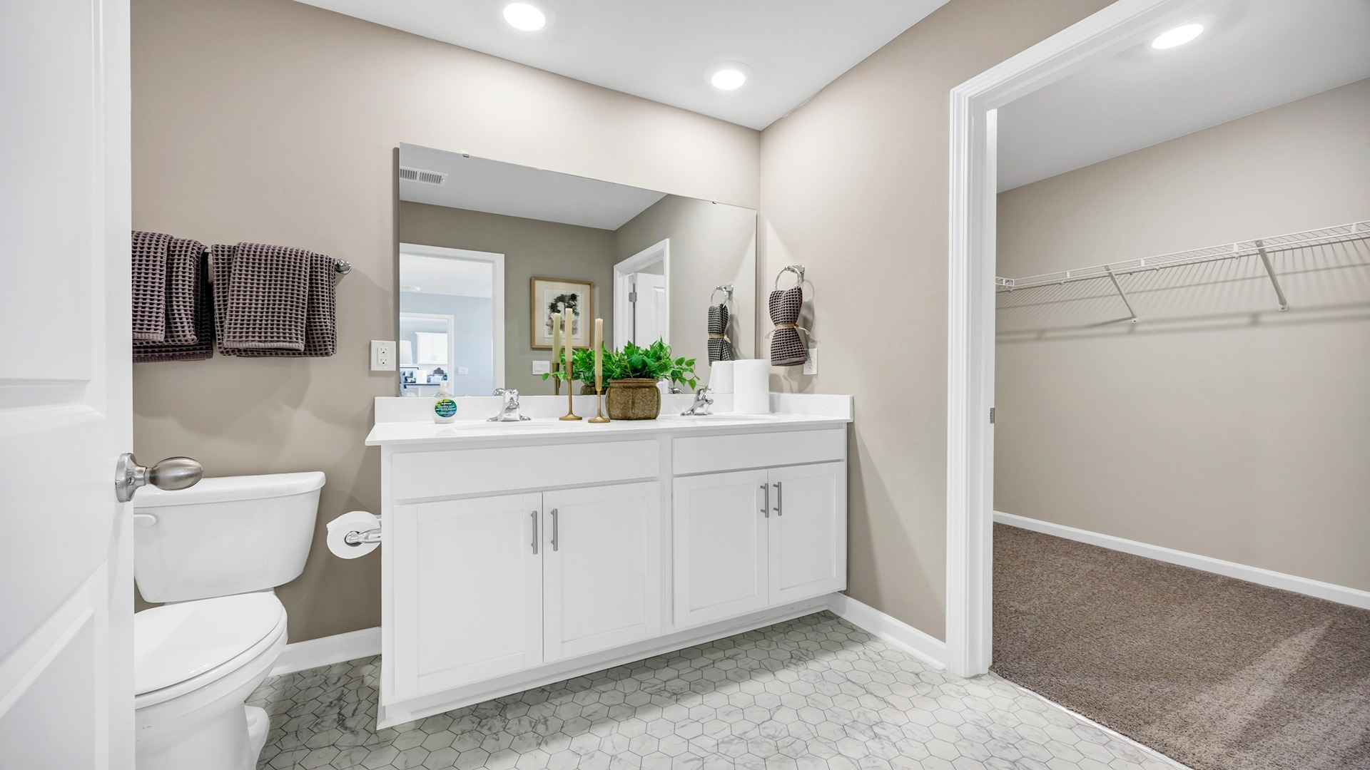 En-suite primary bathroom and walk-in closet