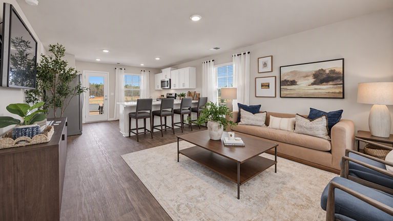 View of open concept floor plan in new home from the front entrance
