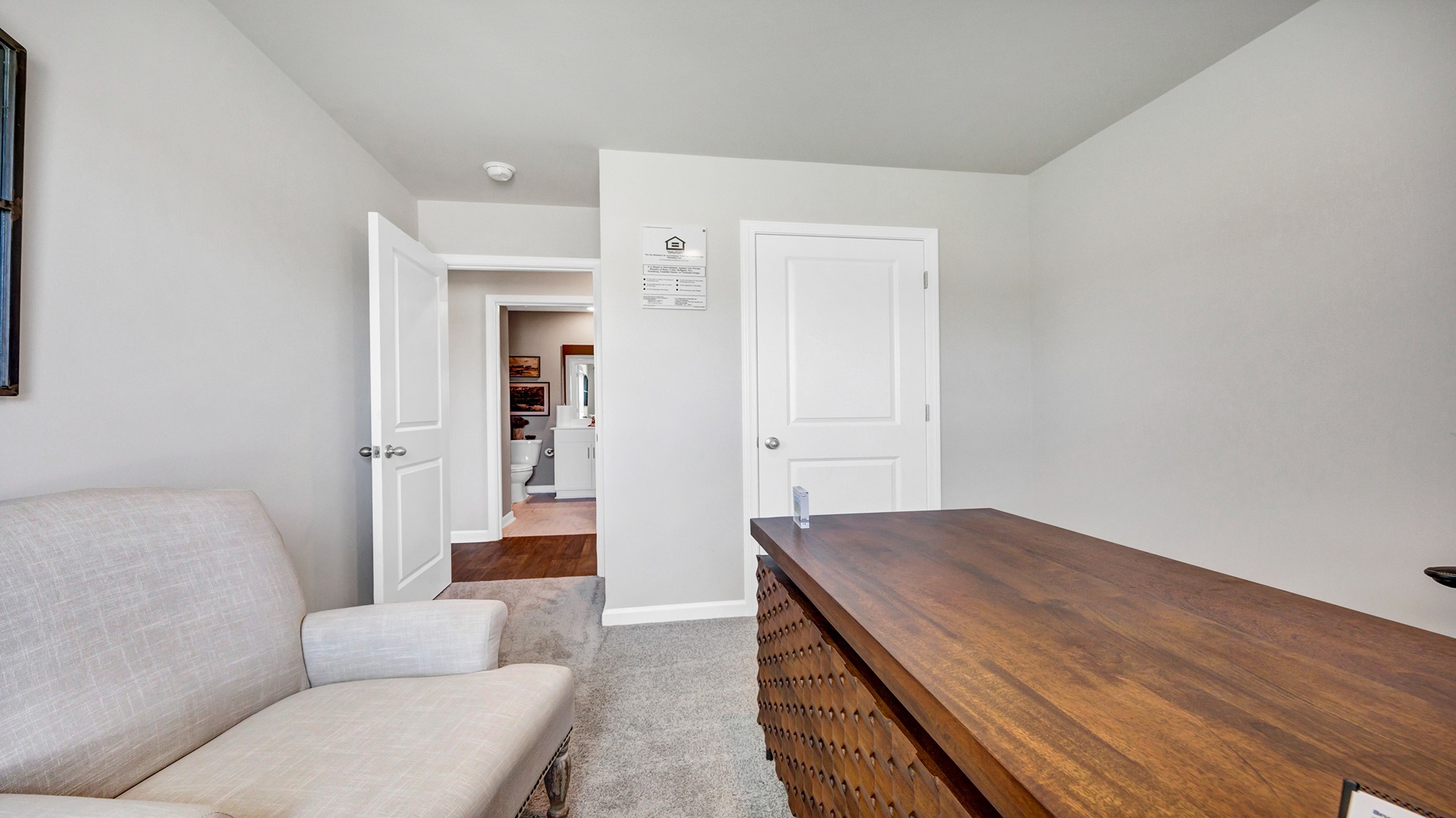 Bedroom 3 with a private closet and carpet flooring