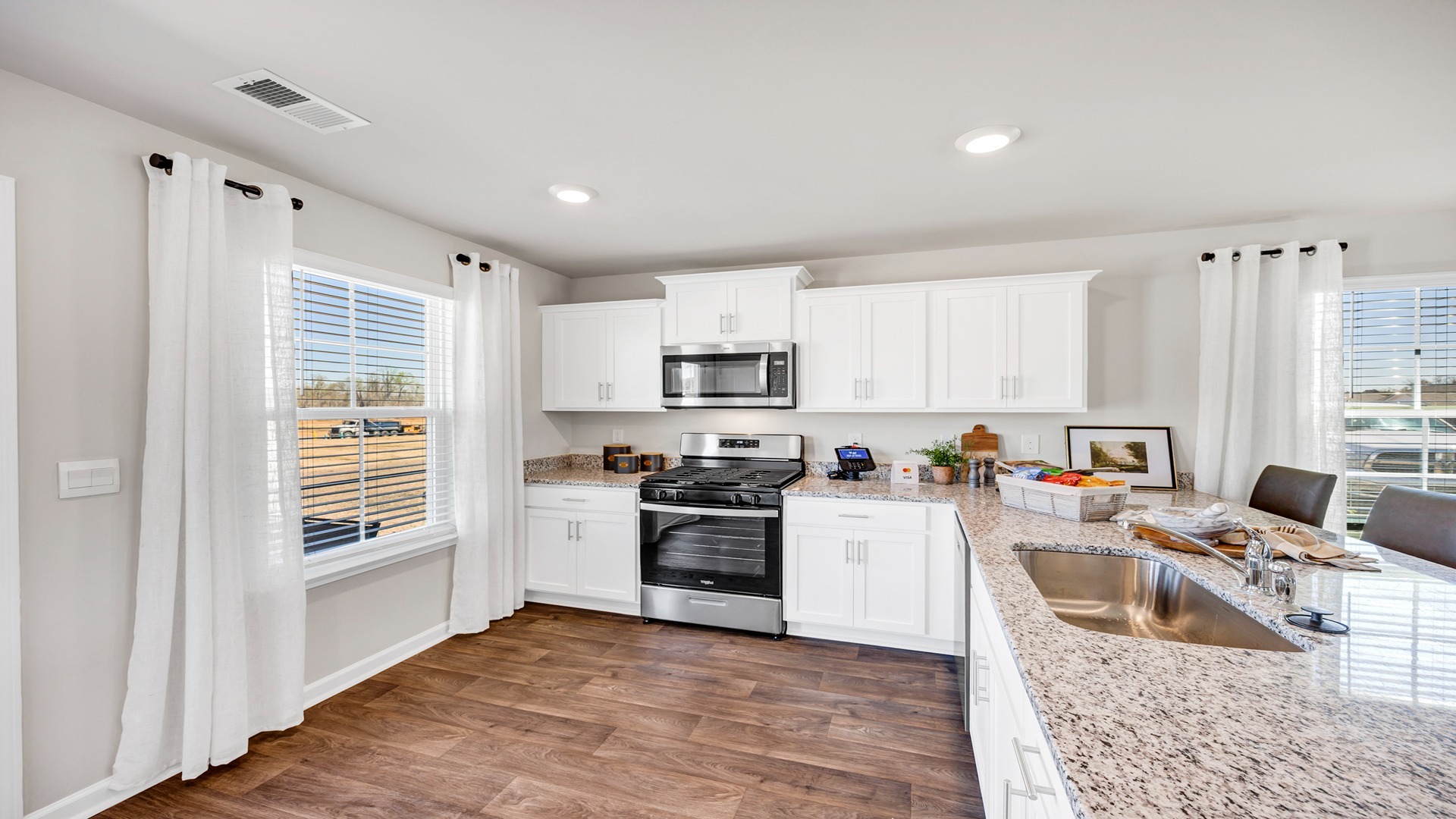 Several windows in the kitchen space for natural light