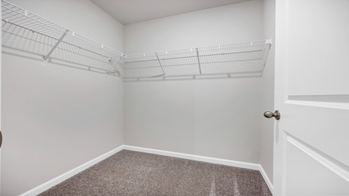 The primary walk-in closet is spacious.