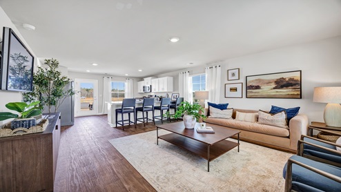 Exiting the bedroom hallway brings you back out into the living space.