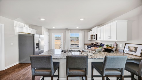 There is room for barstool seating at the kitchen bar.