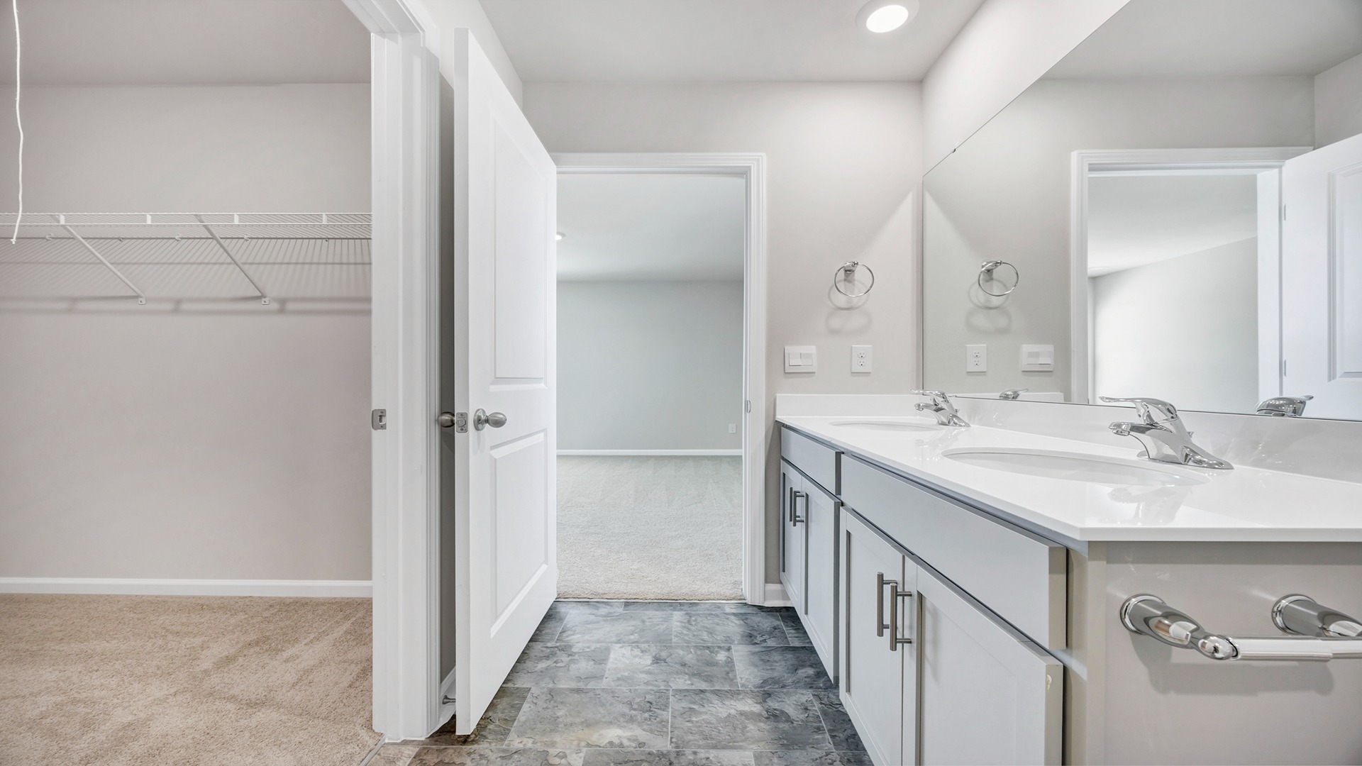Walk-in closet and en-suite primary bathroom
