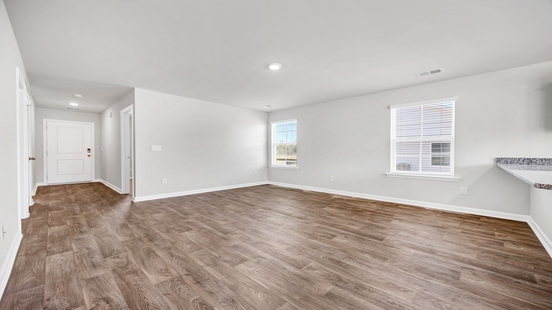 The front entrance and foyer opens up into the spacious living area