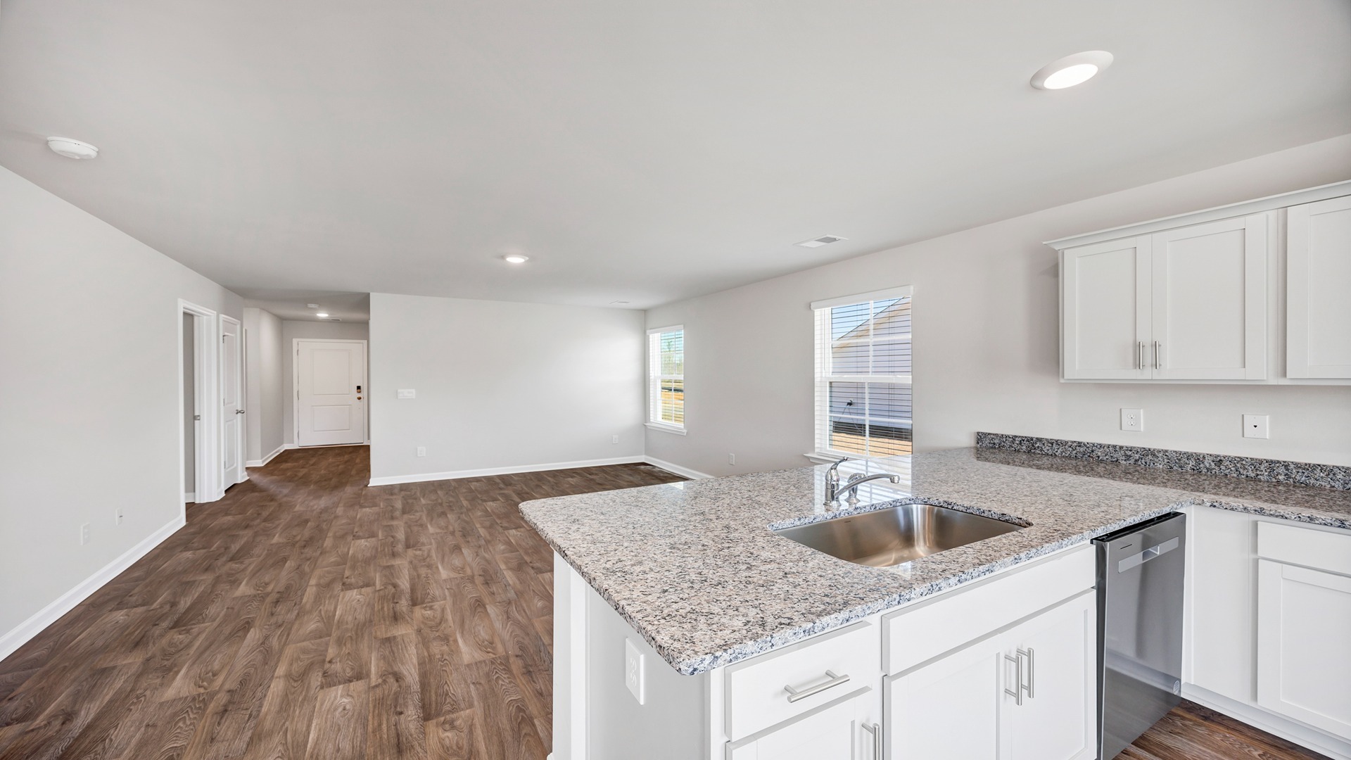 Kitchen sink on the bar overlooks the open living area
