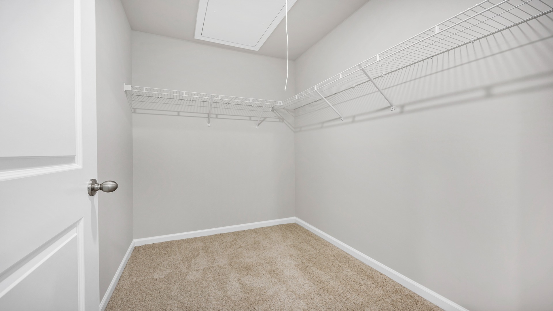 Walk-in primary closet in the primary suite