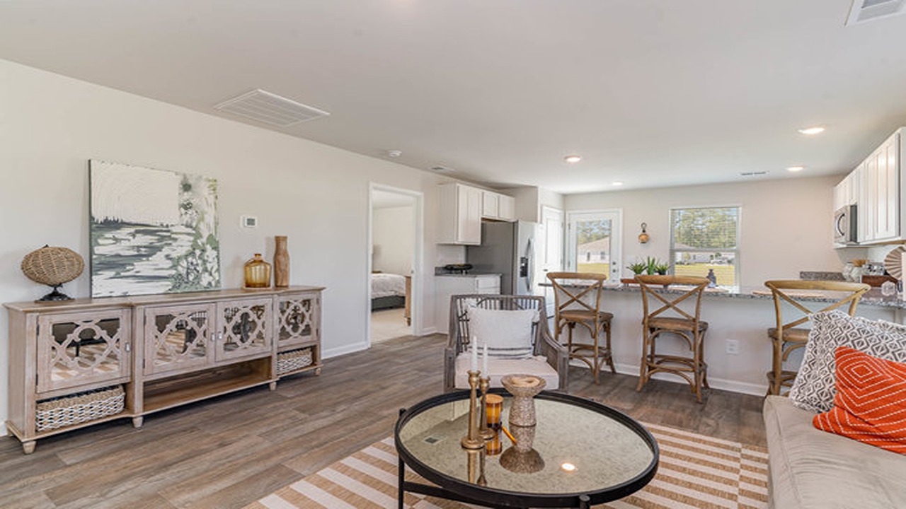 The living area and kitchen are open concept and finished with vinyl flooring.