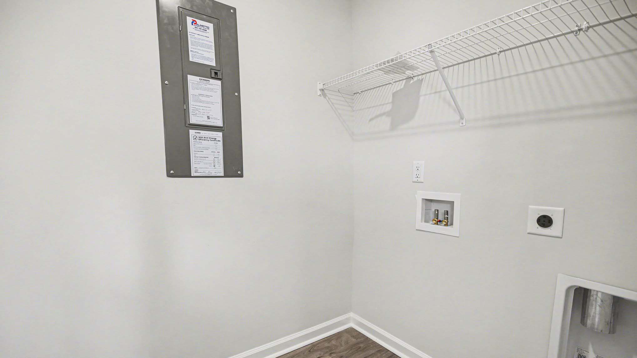 Laundry room downstairs with wire shelving