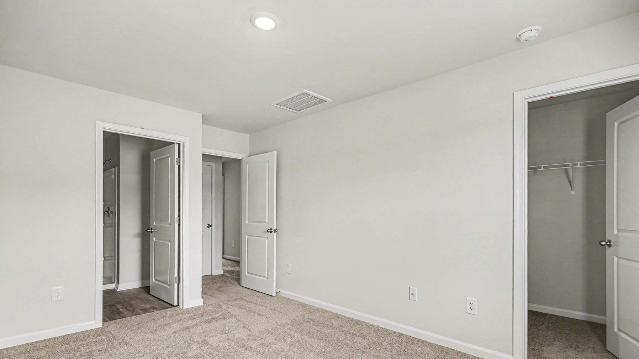 Primary suite upstairs with en-suite bathroom and walk-in closet