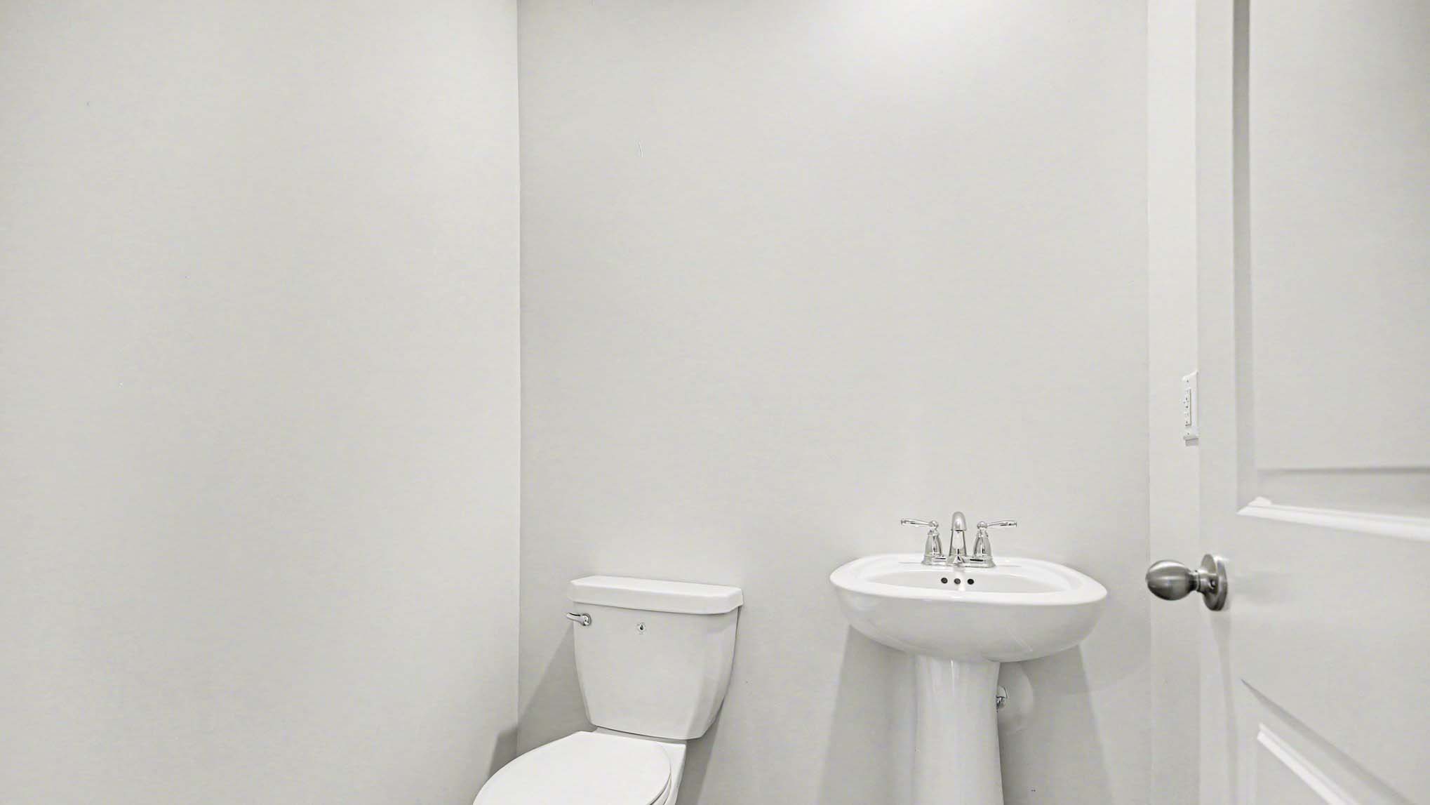 First-floor powder room in two-story home for sale in Orangeburg, SC