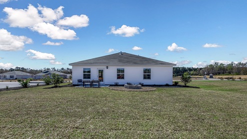 Back Exterior featuring paved back patio.