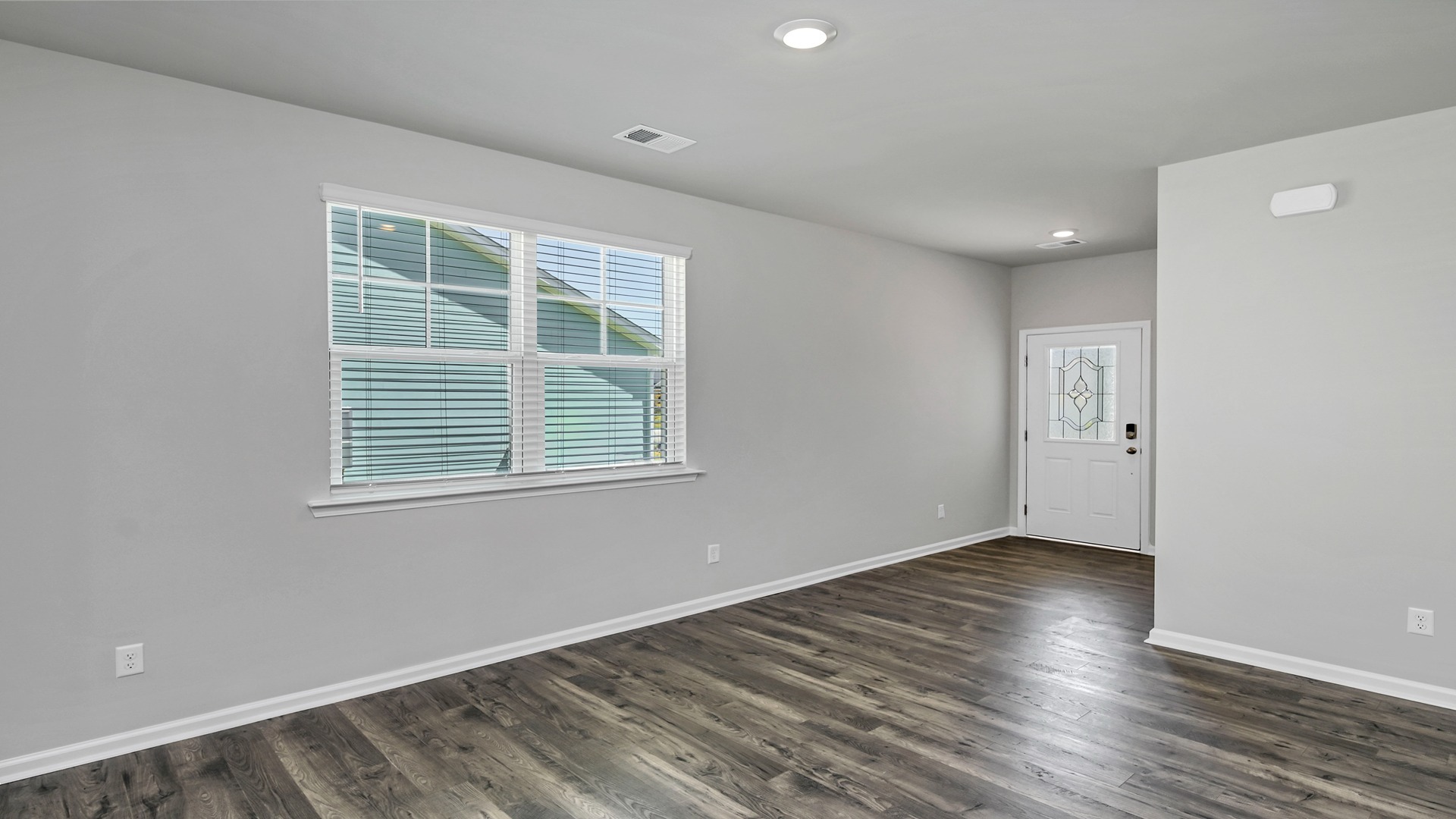 Front entrance of the home leads into the open dining area