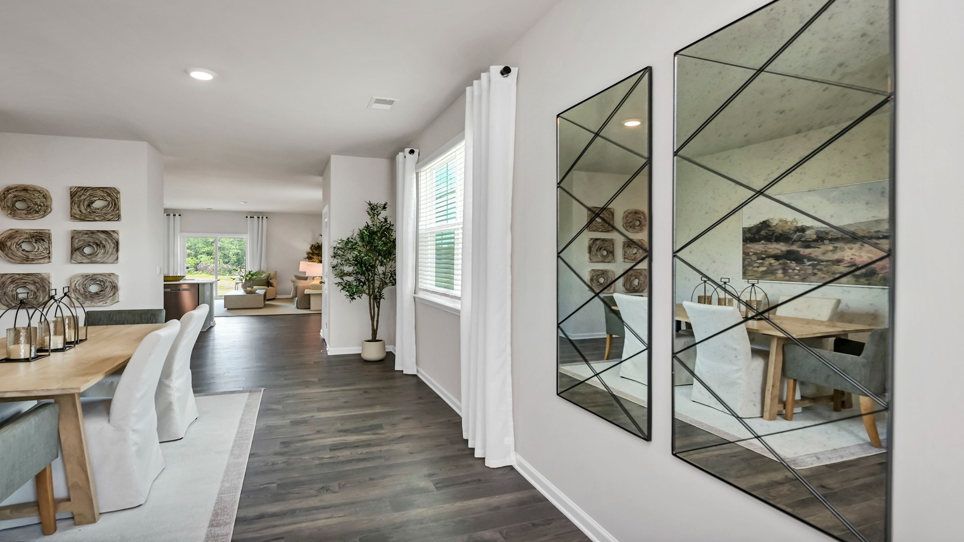 Dining area leads in the kitchen and living areas