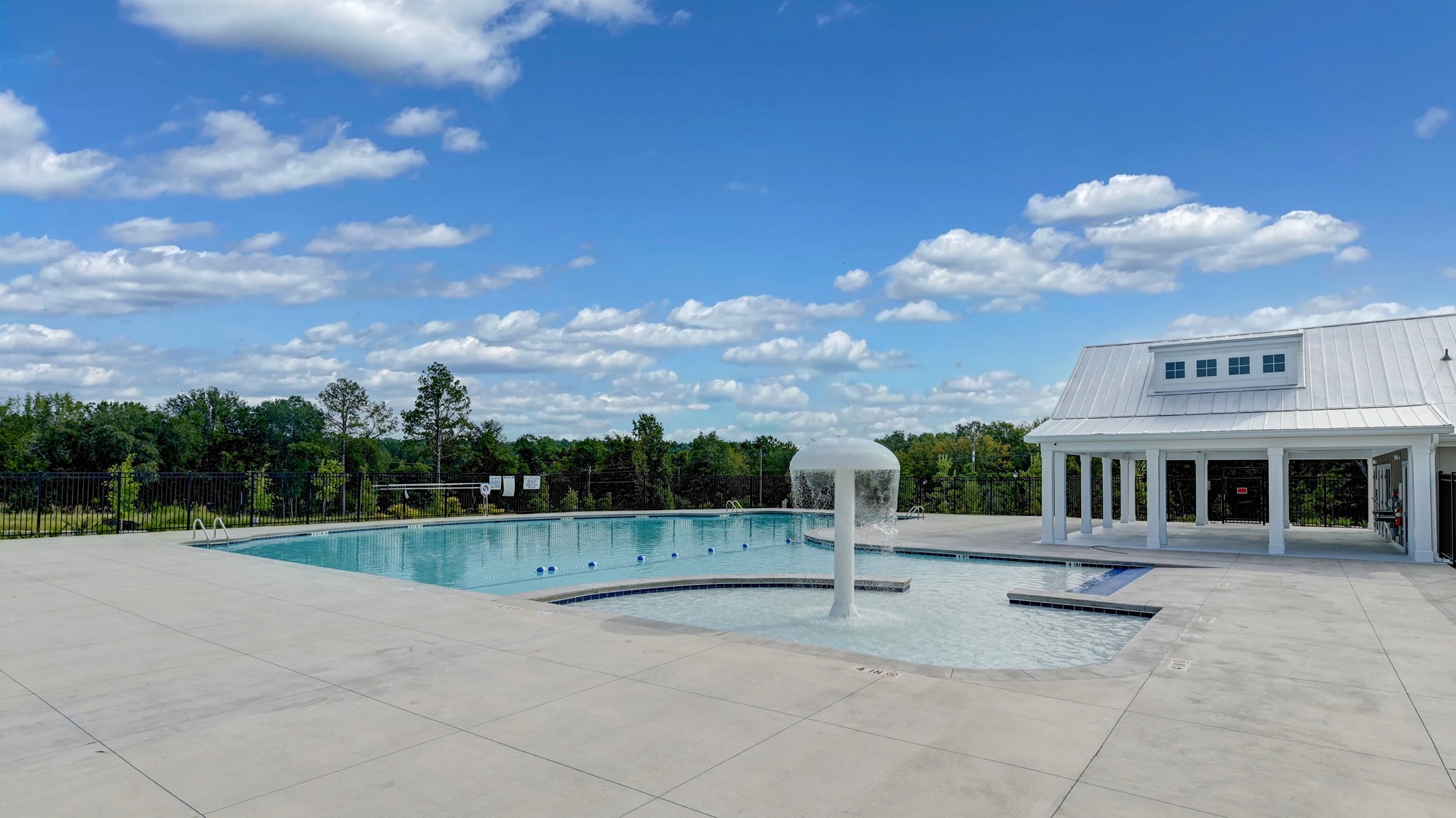 Shallow fountain area for kids in the community pool