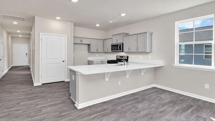Front foyer opens into the kitchen area of the Cameron floor plan