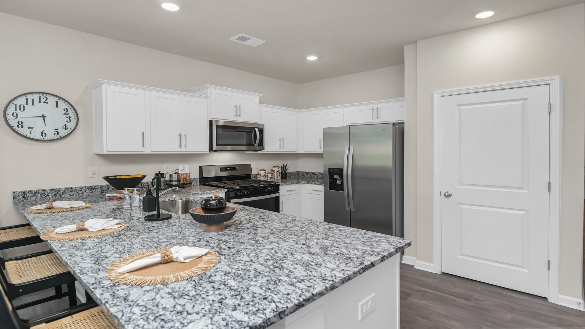 There will be white quartz countertops in the kitchen of new construction home for sale in Lexington, SC