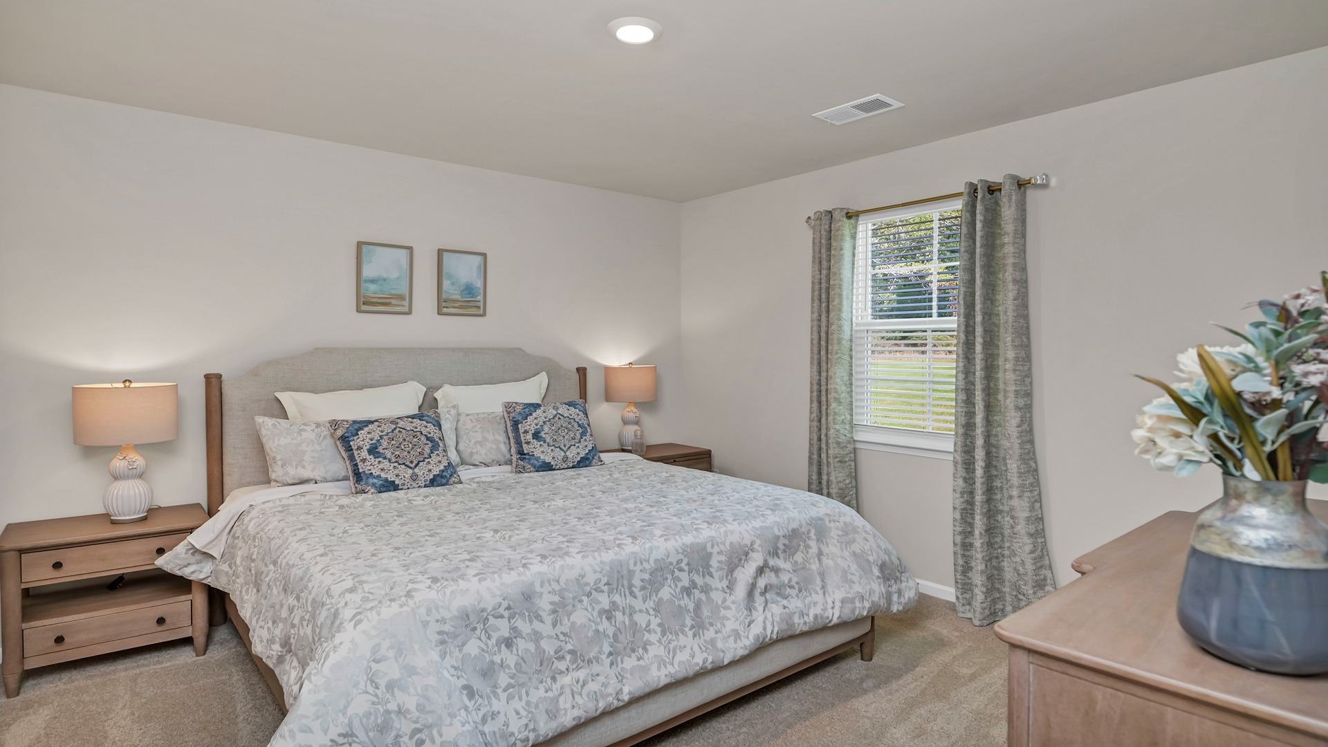 The primary suite is at the back of the home off the main living space