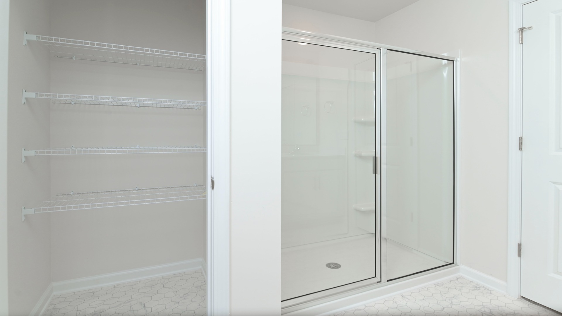 Standup shower and extra storage in primary bathroom