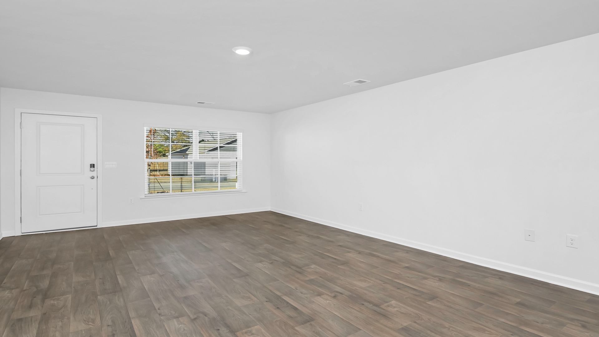 Front entrance and living area finished with vinyl flooring