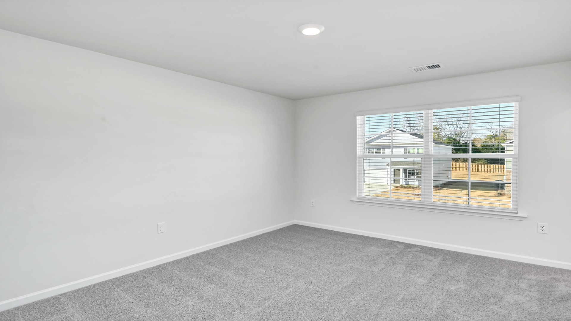 Large front facing window in bedrooms 2 and 3 of the Harrison