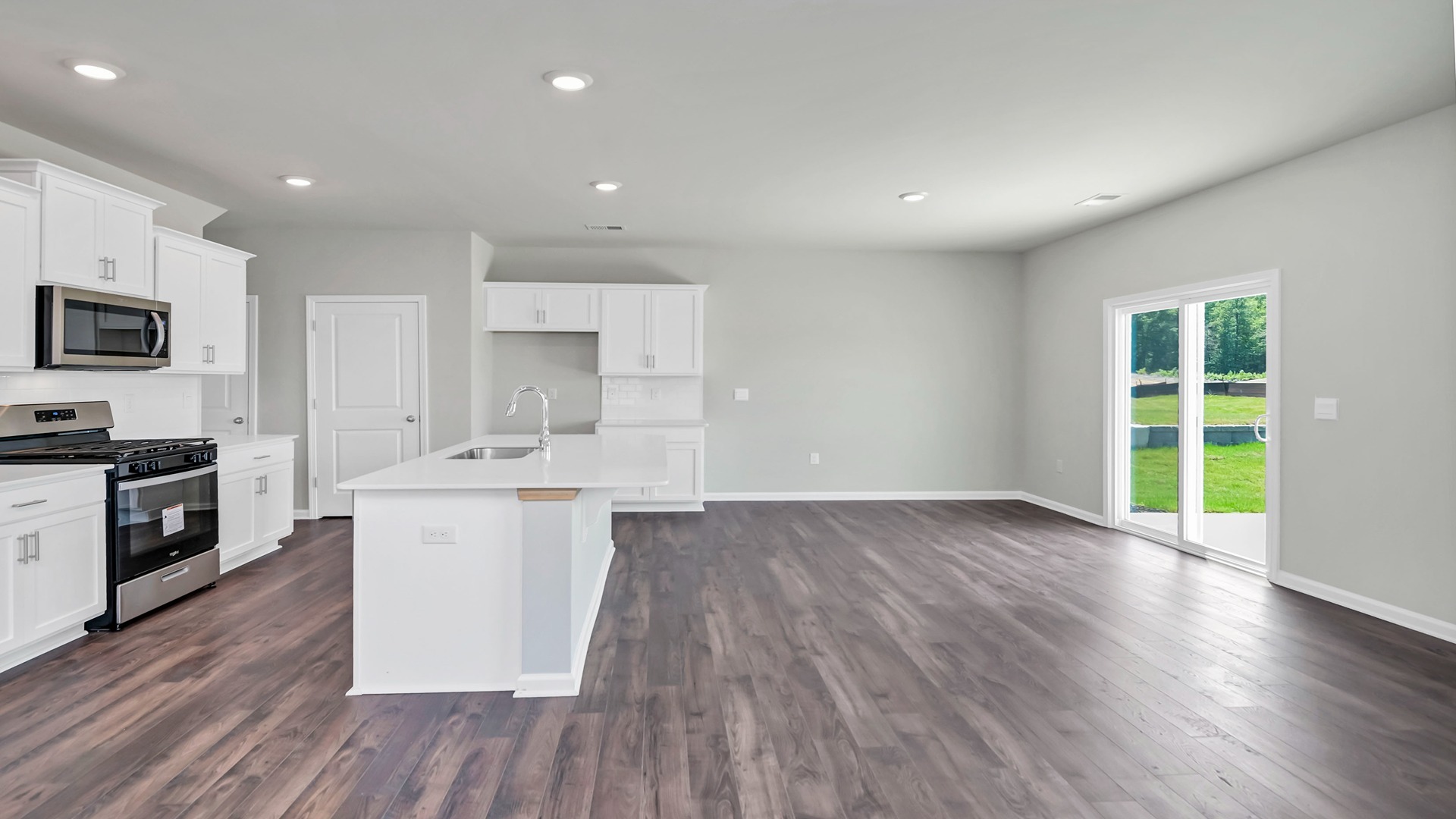 Open concept Aisle kitchen and dining area with natural light