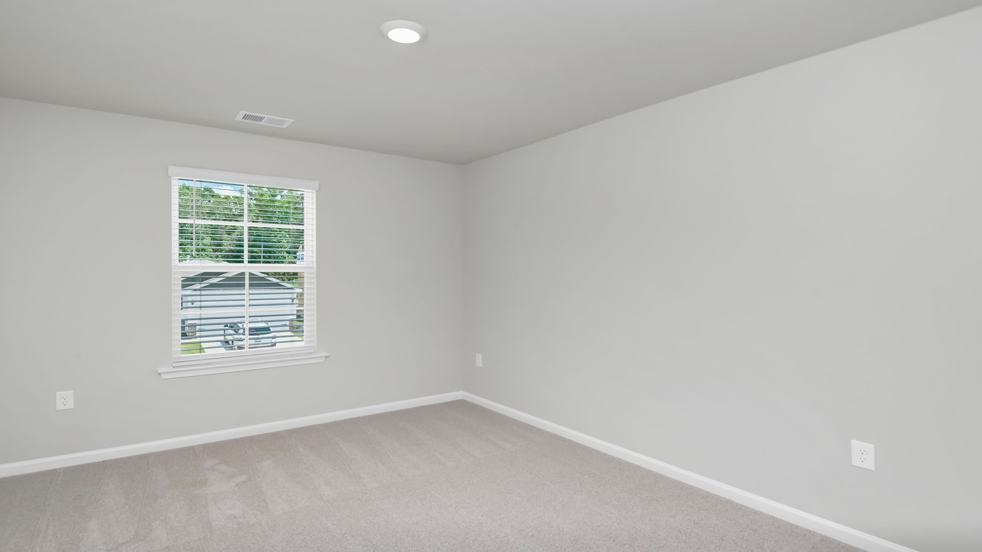 Bedroom 3 upstairs in the Aisle with a window and carpet flooring