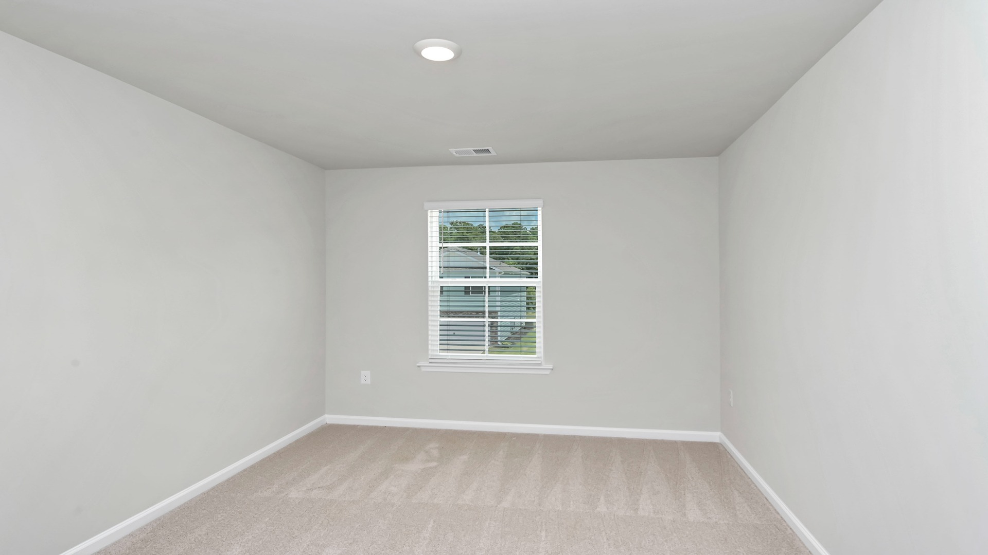 Bedroom 3 upstairs in the Aisle with a window and carpet flooring