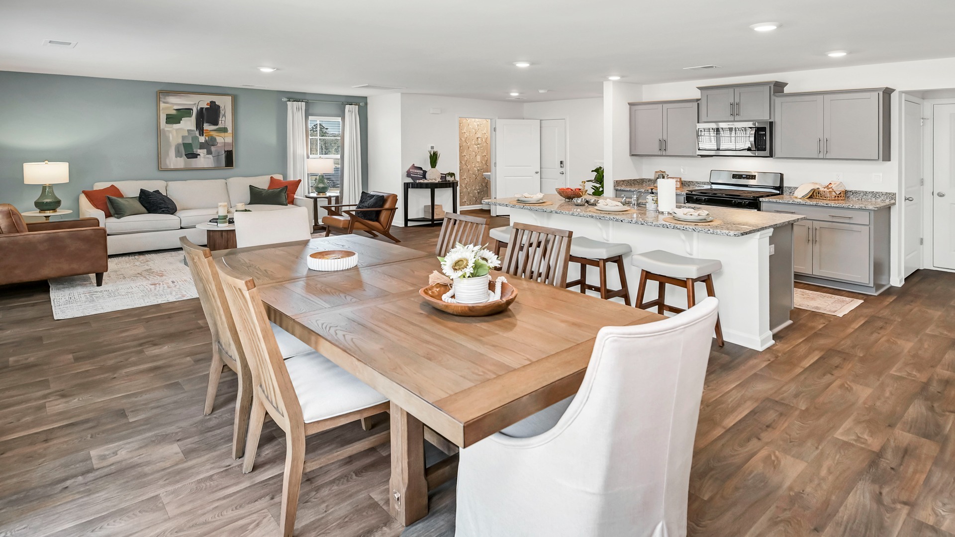 Open concept dining, kitchen, and living areas