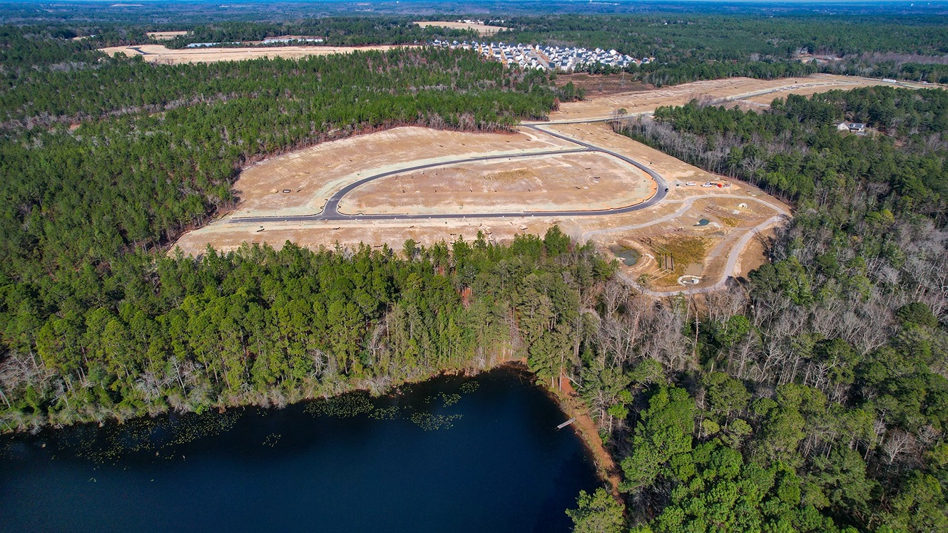 There is a pond nearby the back of the community