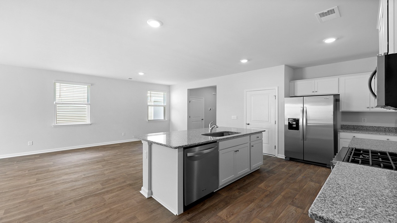 Dining and kitchen areas with vinyl flooring