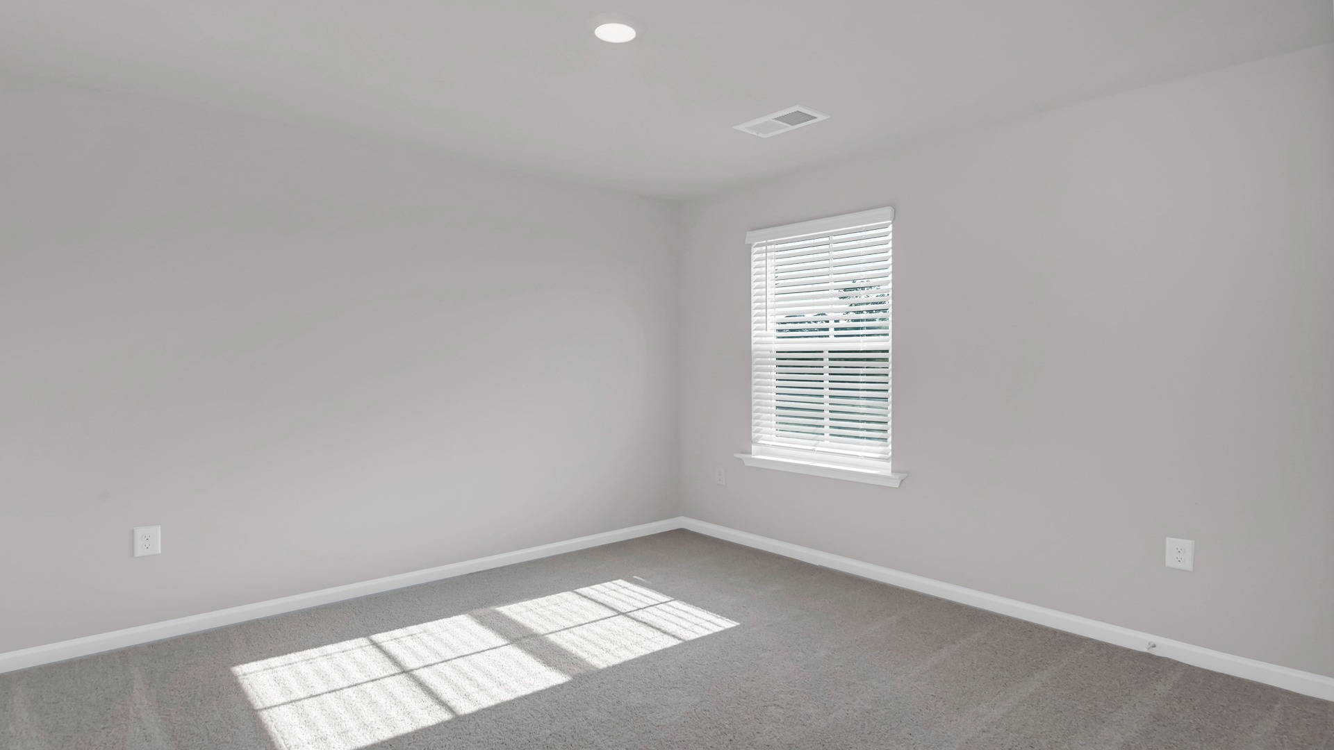 Bedroom 3 with carpet flooring and a window for light