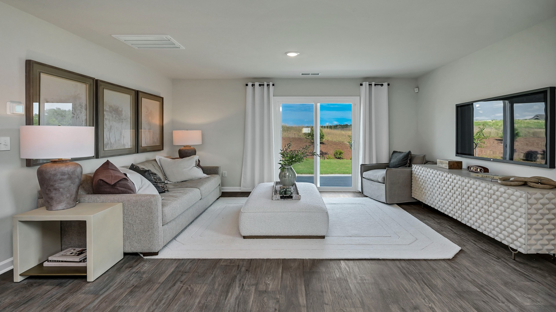 Spacious living area in home for sale in Lexington, SC with vinyl floors and natural light