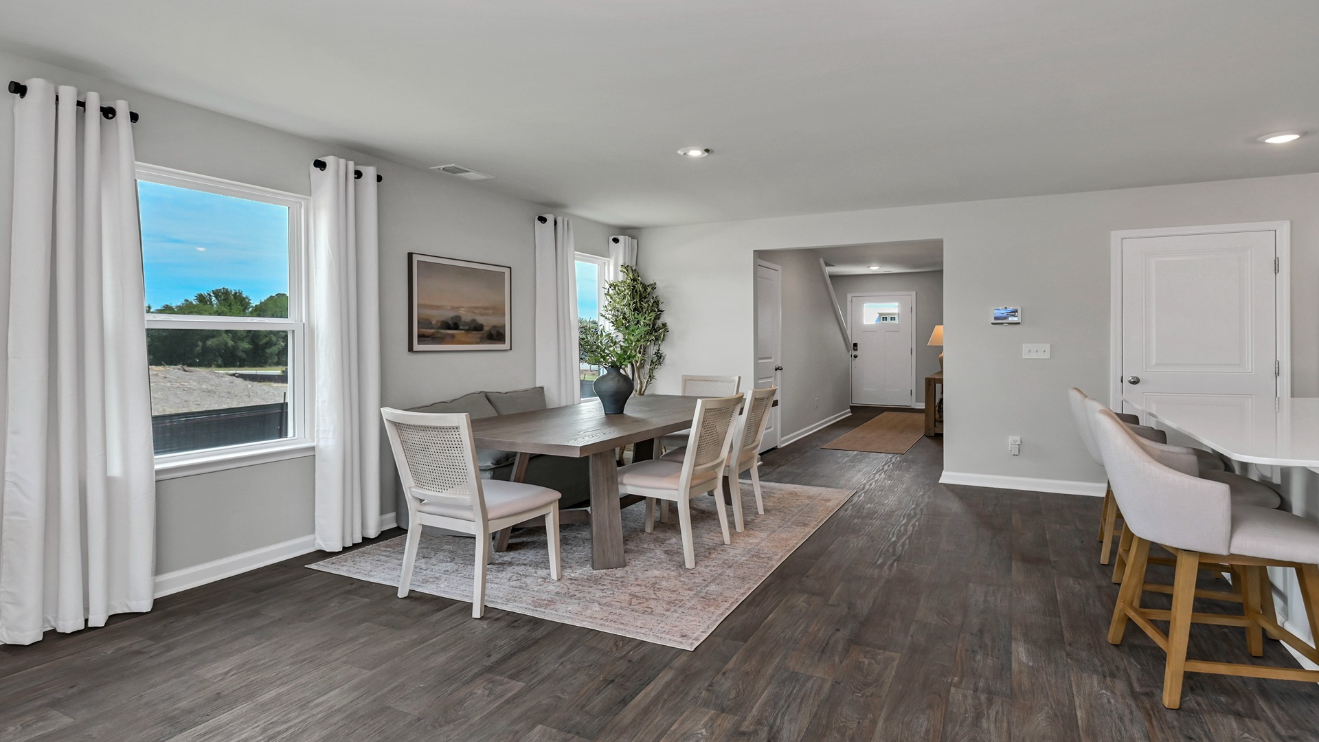 Back out through dining and kitchen area to the stairs in the front foyer