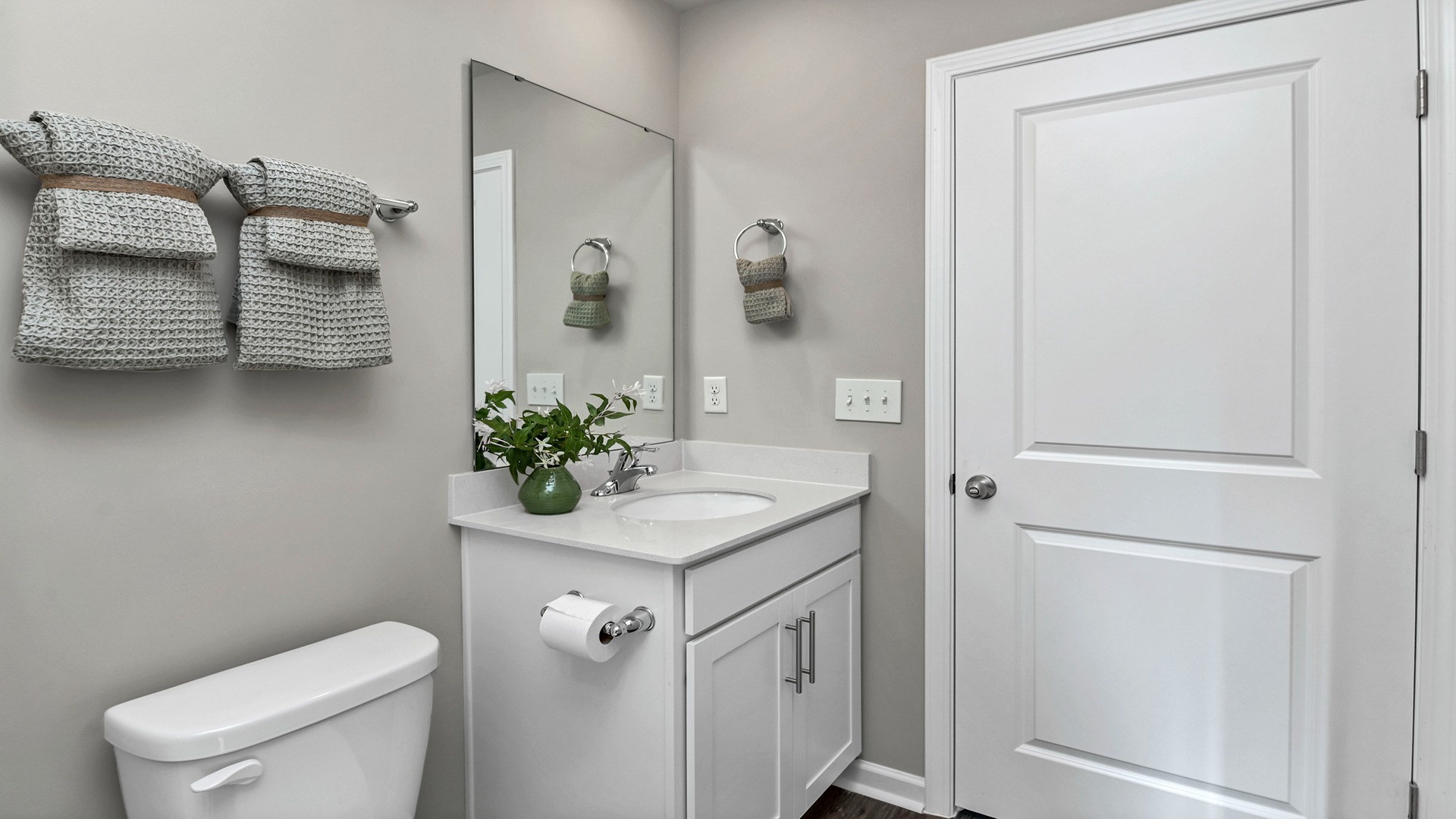 Single-sink vanity with quartz countertops in downstairs Robie bathroom