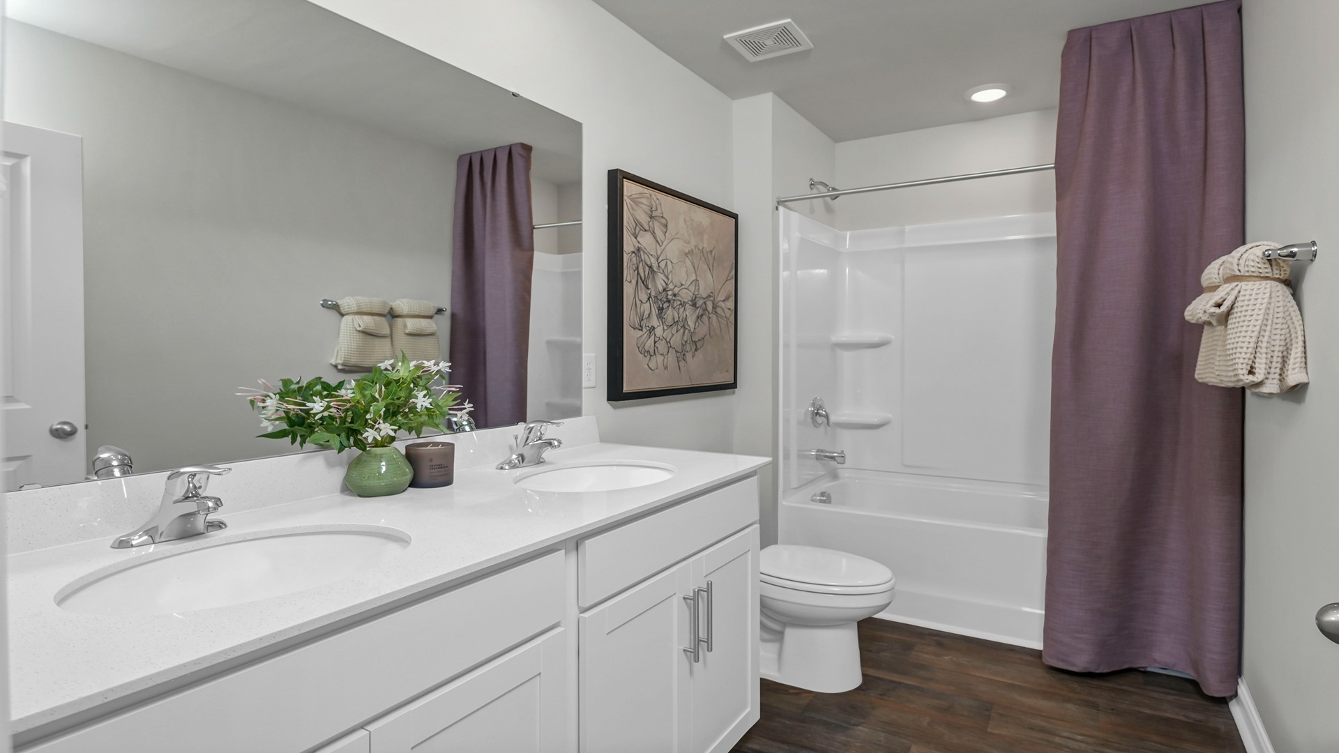 Bathroom 3 upstairs with a double vanity and shower tub