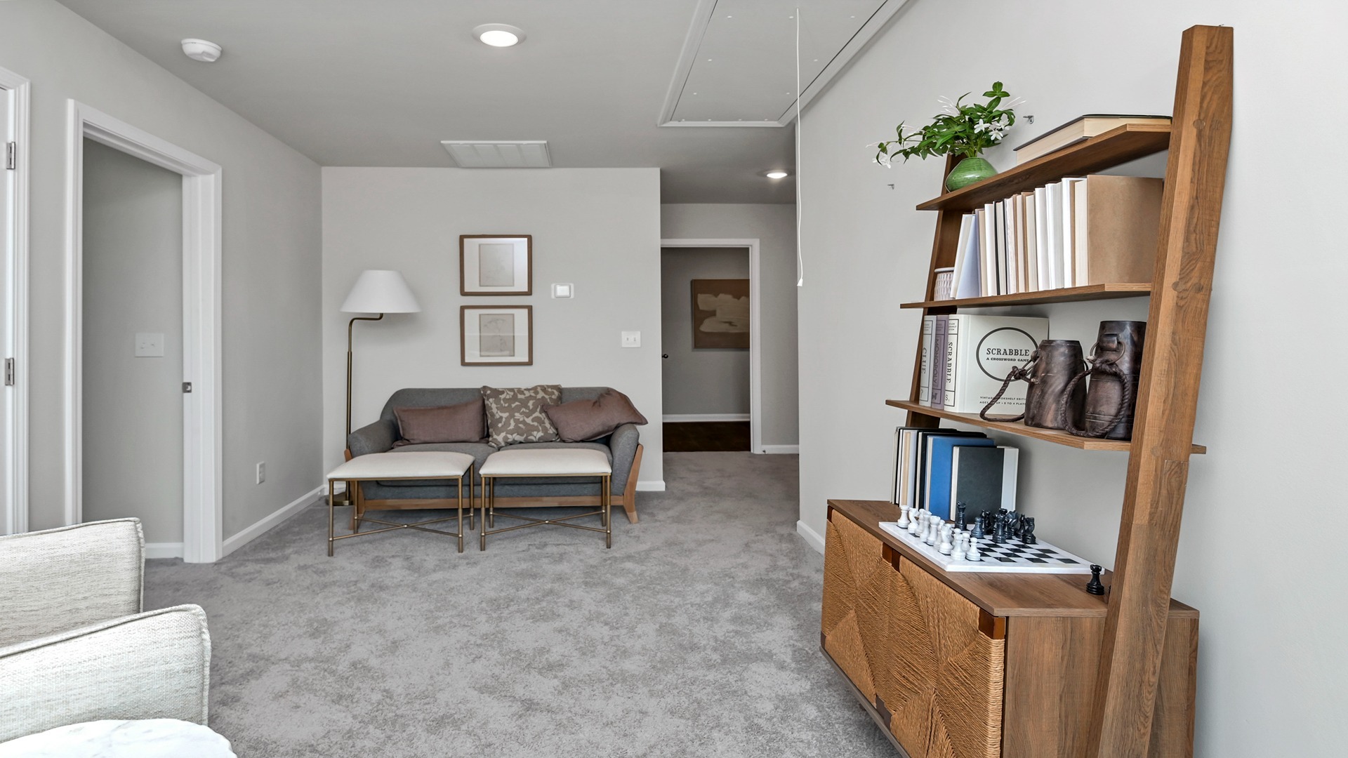 Upstairs loft space with carpet floors and halls leading to all upstairs bedrooms