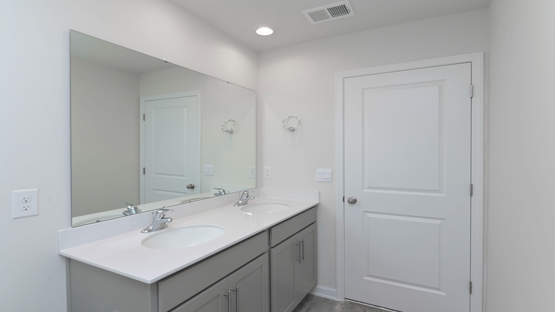 Bathroom 2 upstairs with a double vanity and shower/tub combo