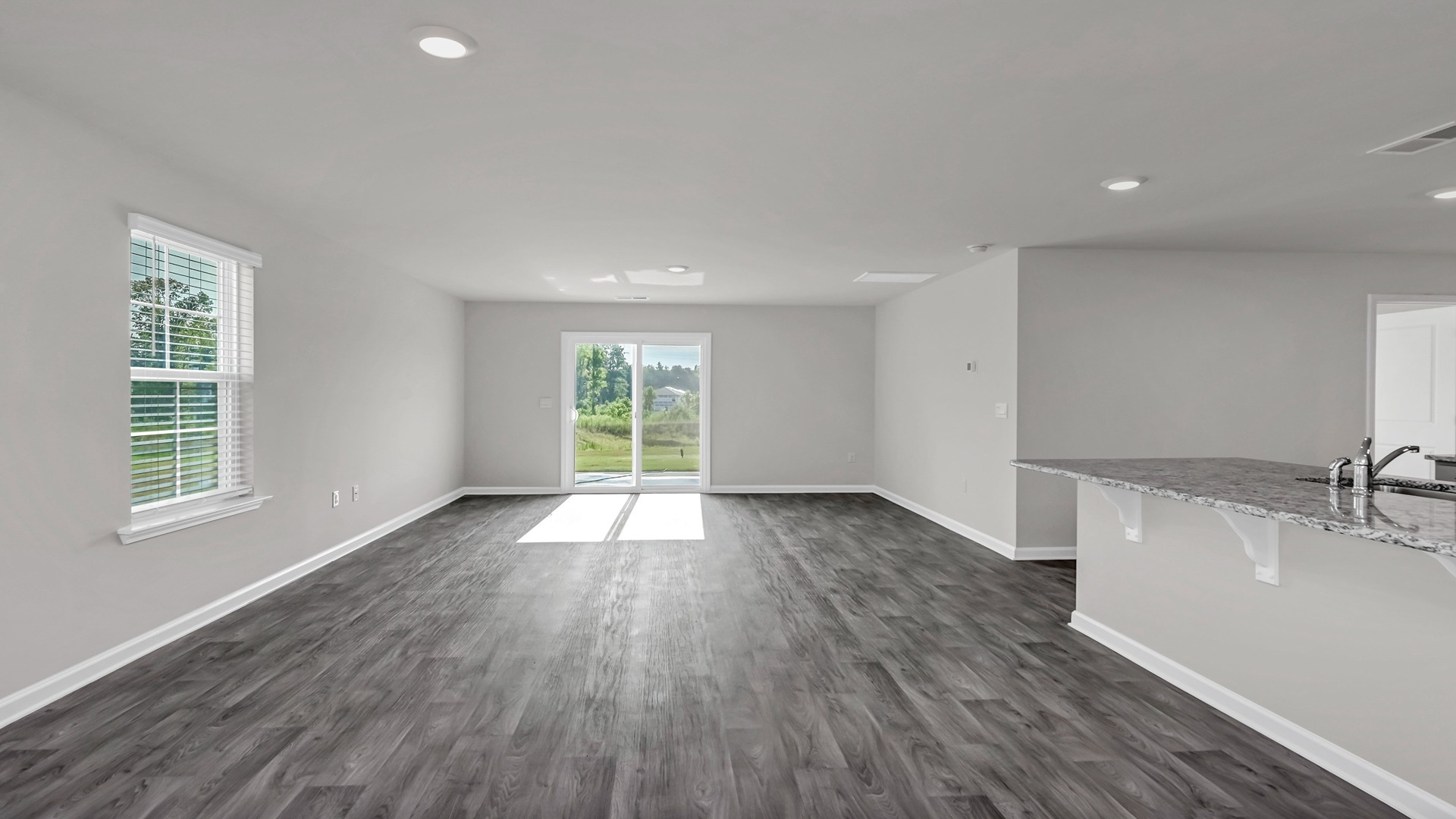 The kitchen and living areas are open concept with natural light