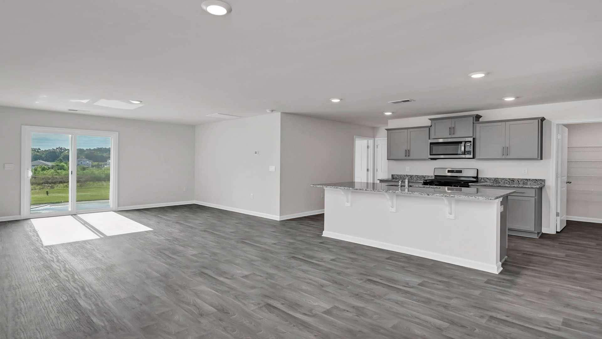 The kitchen and living areas are open concept with natural light