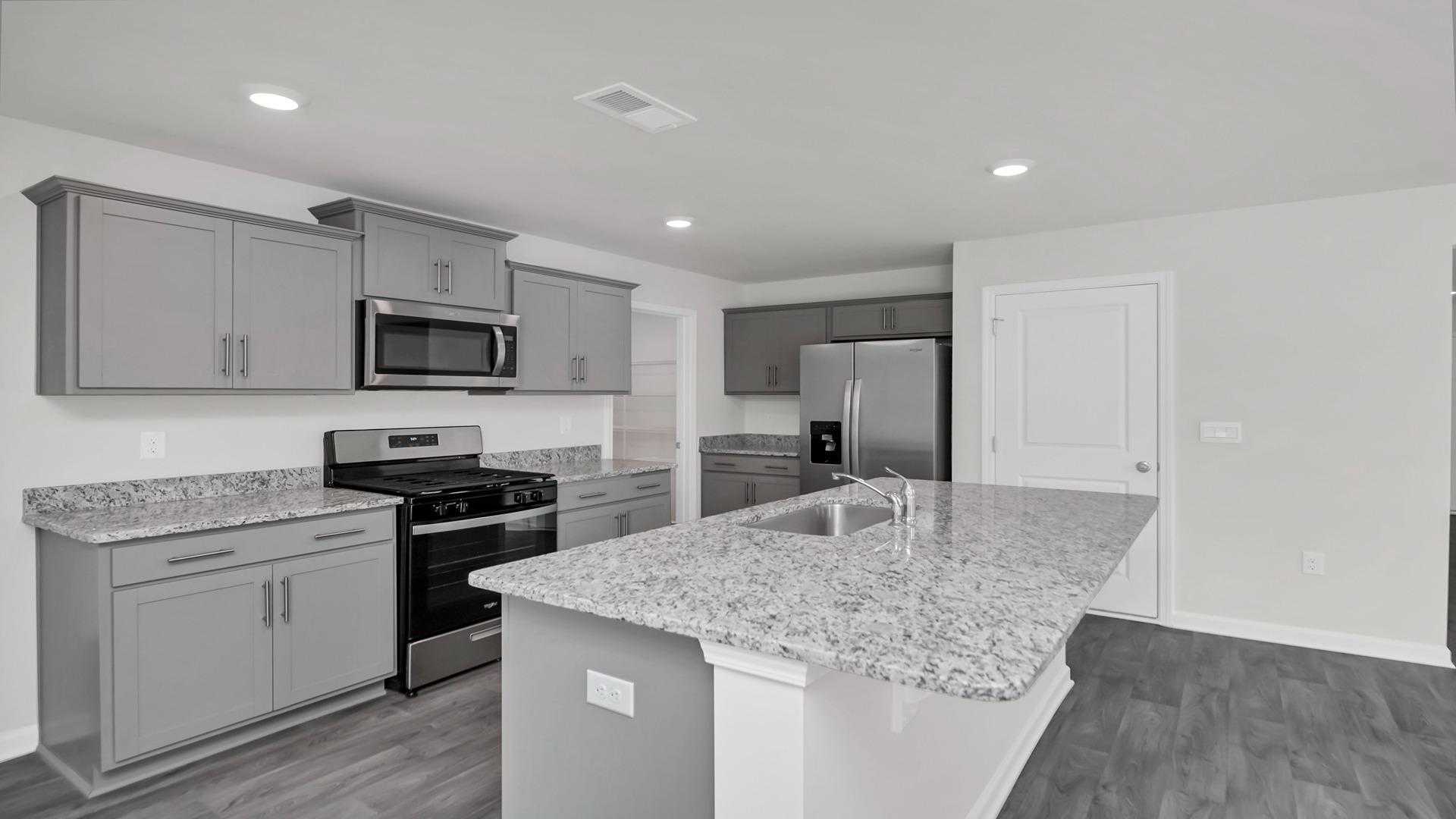 There is space for barstool seating at the kitchen island