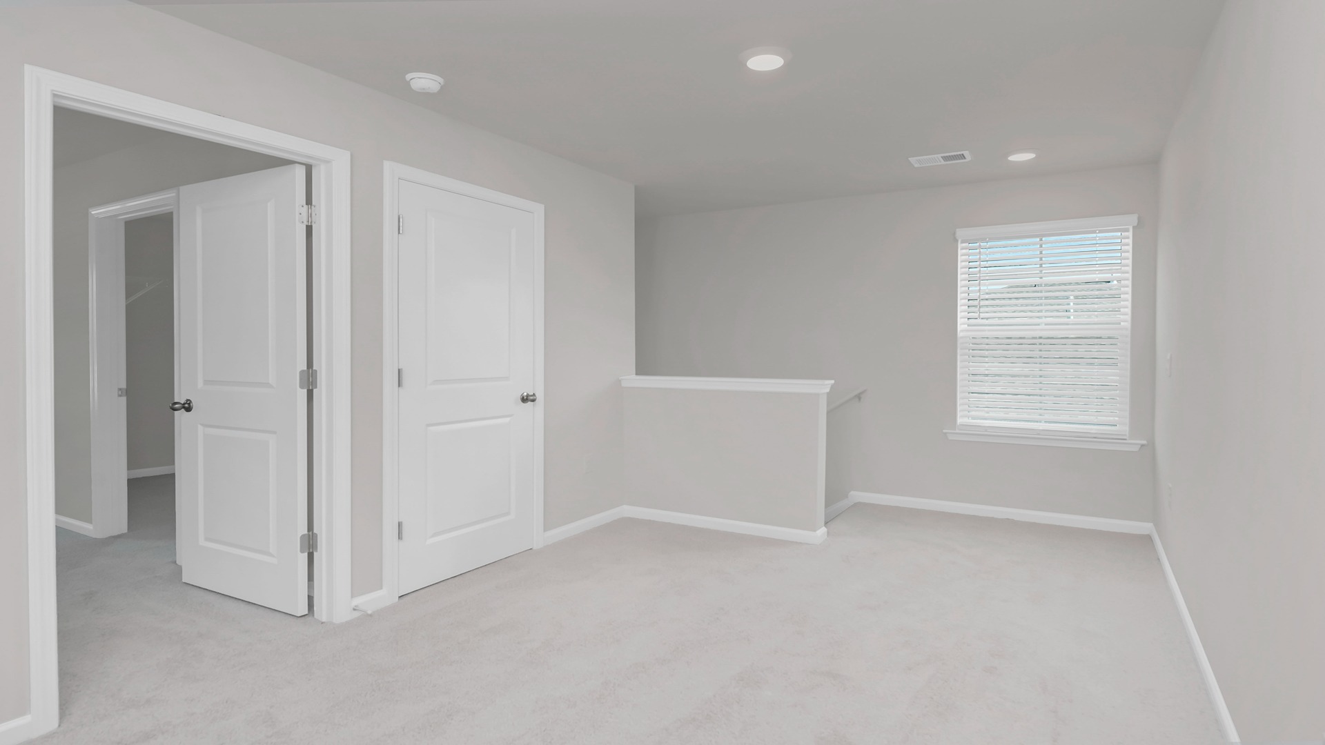 Upstairs loft area at the top of the stairs.