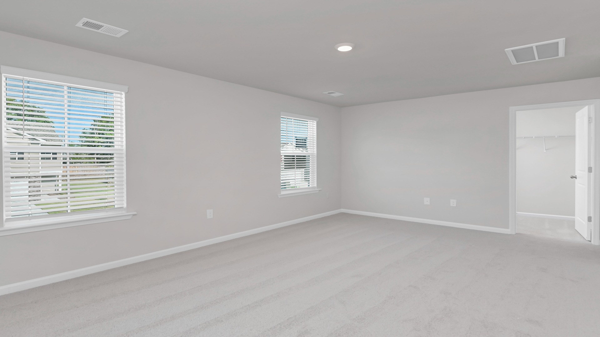 Spacious primary bedroom upstairs