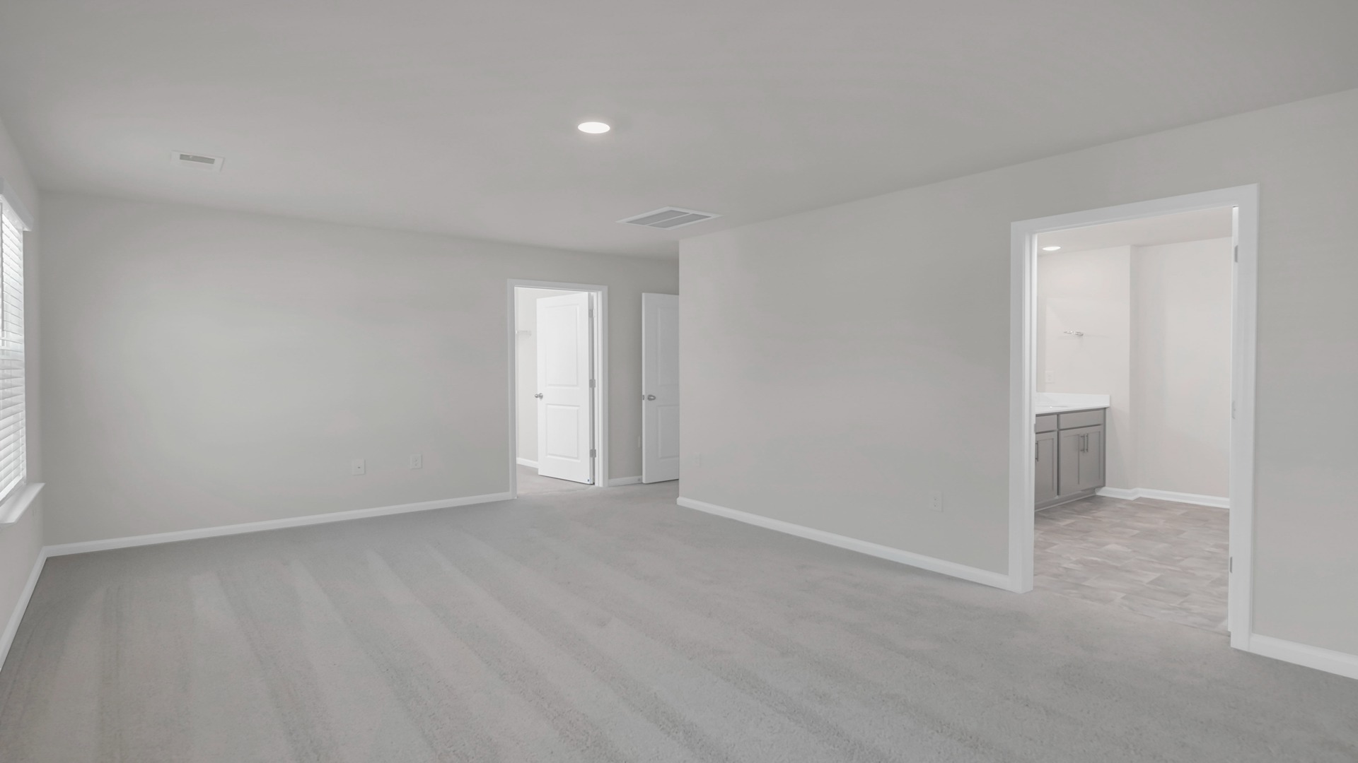 Spacious primary bedroom upstairs