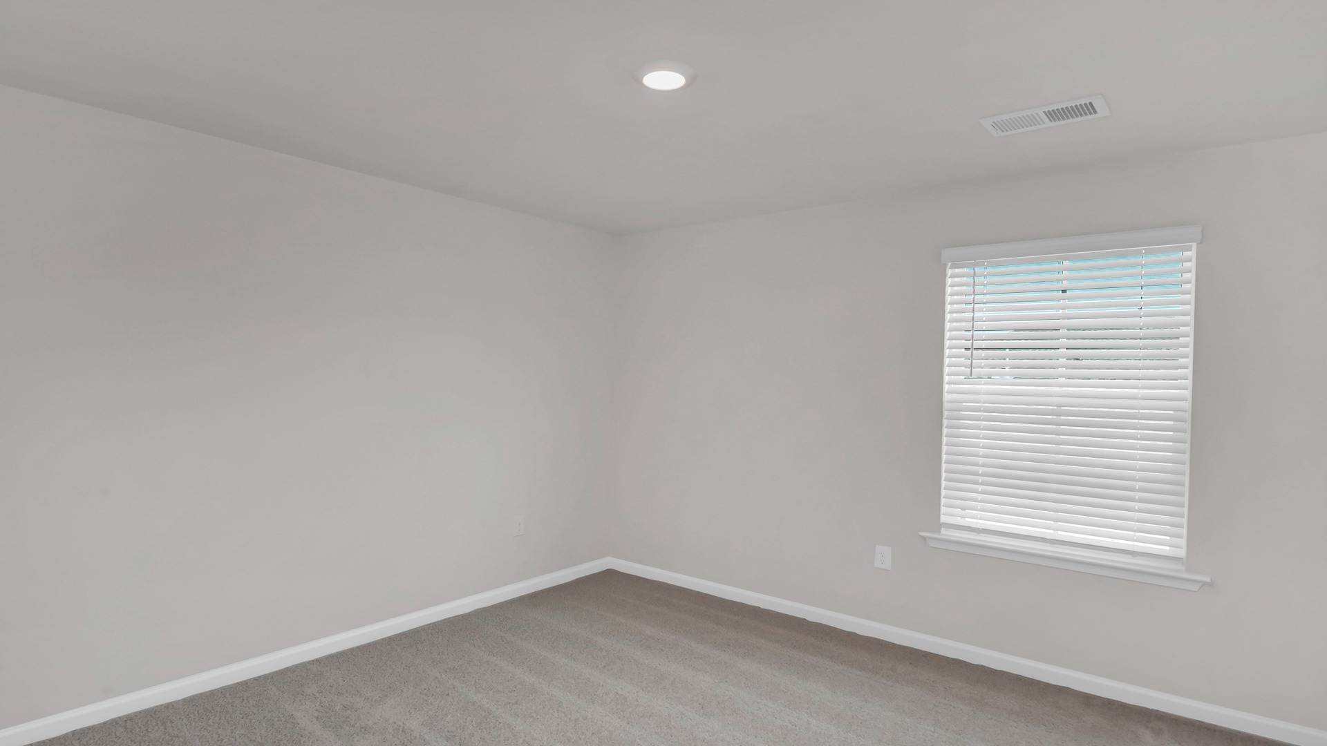 Bedroom 5 with a window and carpet flooring upstairs