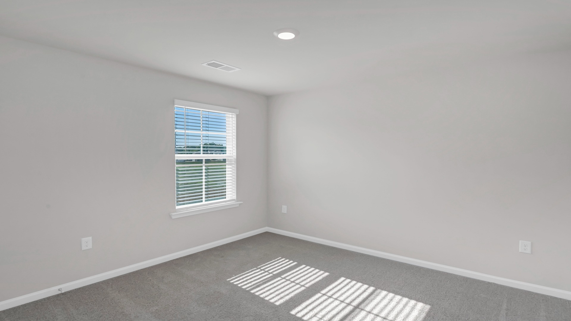 Bedroom 4 with carpet flooring and a window