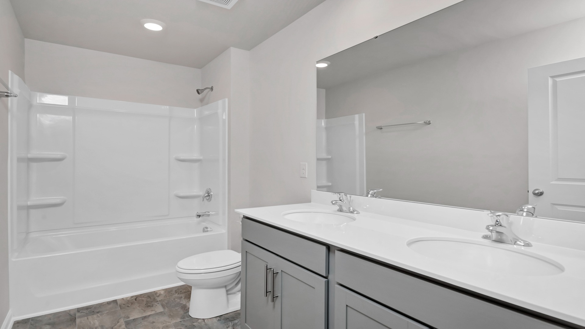 Bathroom 2 upstairs with a double vanity and shower/tub combo