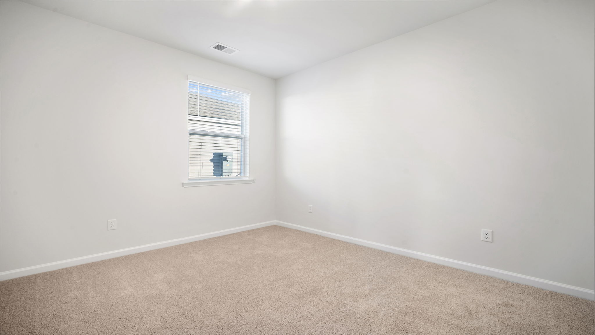 Bedroom 2 with window and carpet flooring